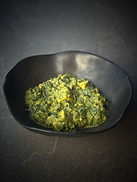 Vegan palak paneer with crispy tofu, spinach sauce, peas, and cilantro