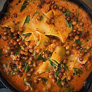 Creamy vegan lasagna soup with spinach, broken noodles, and crispy chickpeas