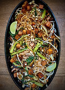 Vegan Pad Thai with crispy tofu, mushrooms, bok choy, peanuts, and lime