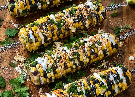 Vegan Mexican street corn with mayonnaise, chili powder, paprika, cilantro, and lime