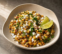 Mexican street corn salad with cilantro, jalapeño, red onion, lime, and smoked paprika