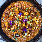 Pearled couscous with roasted cauliflower, chickpeas, coconut milk, lime, and cilantro