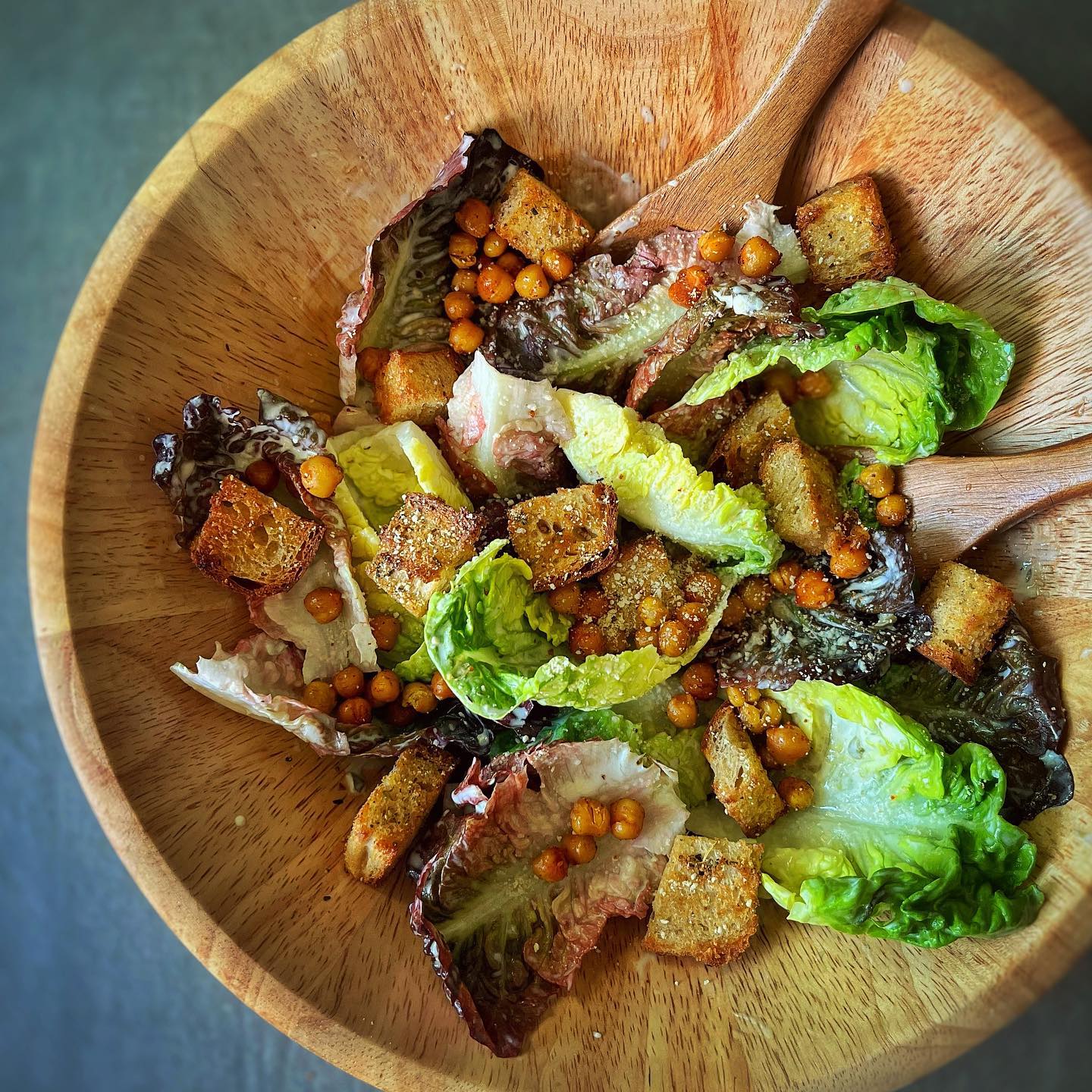 Vegan Caesar salad with roasted chickpeas, croutons, avocado, and walnut parmesan