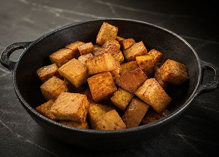 Golden pan-fried crispy tofu cubes seasoned with soy sauce
