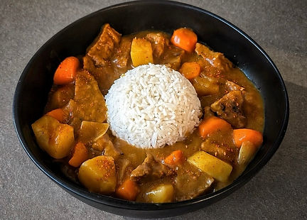 Japanese golden curry with seitan, potatoes, carrots, and steamed rice