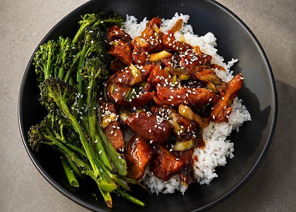 Vegan teriyaki seitan chicken bowls with white rice, roasted broccolini, green onions, and sesame seeds
