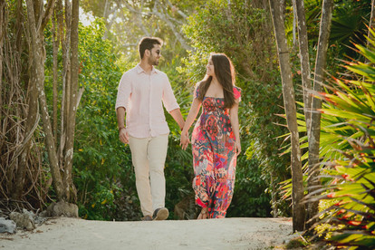 Couple walking holding hands in Tulum photoshoot