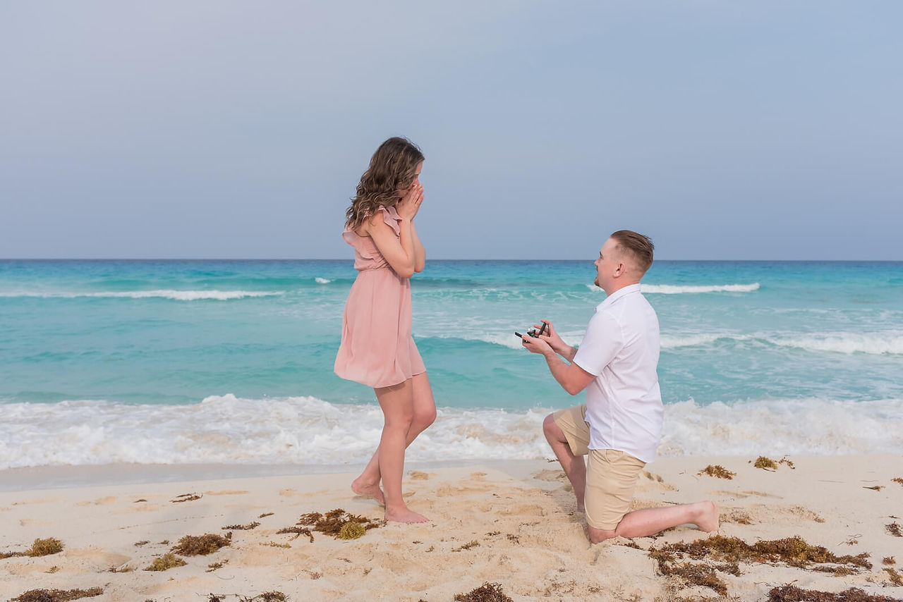 groom on his knee poping the question