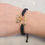 Thumbnail: Jeweled Caribener Black Cord Charm Bracelet 