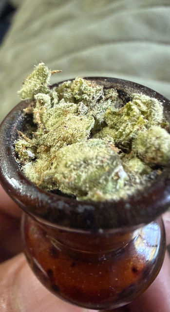 a freshly packed bowl of donkey butter that is showcasing huge trichomes in large nests.