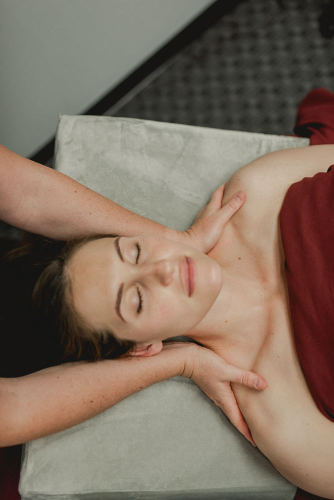 a new mother receiving a postpartum massage