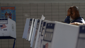 A man reacts at a voting booth on Election Day at an East Harlem school turned into a polling center in Manhattan, New York City, Nov. 5, 2024.