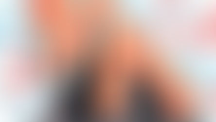 Two students seated at classroom desks, one with a hand raised, facing a large stylized map of California overlaid with red and blue checker-style data squares, suggesting statewide educational trends.