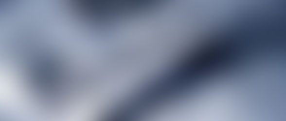 Coins and tax forms with the text "Tax Reform" on torn paper, suggesting financial change. Blue tone gives a serious mood.