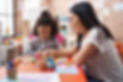 teacher-toddler-playing-with-maths-puzzle-game-sitting-table-kindergarten.jpg