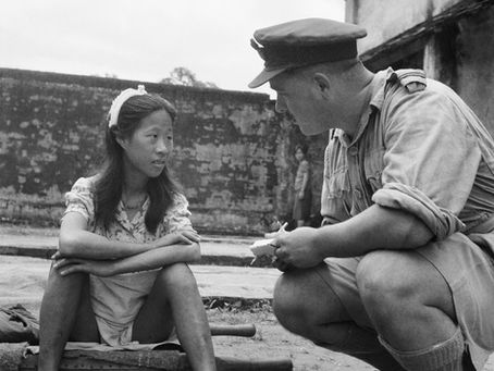 A Chinese "comfort woman" being interviewed by an officer of the Royal Air Force after the liberation of Burma, August 8, 1945