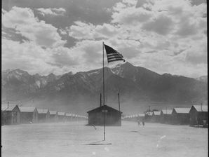 The Manzanar War Relocation Center in 1942. An American flag flies above the barracks that Japanese Americans lived in during their incarceration. 