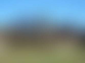 Photograph of the ruins at Pompeii with Mount Vesuvius in the background