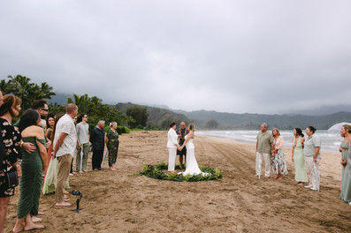 Intimate LGBTQ beach wedding ceremony with Kauai wedding officiant, Moe Aliafune at Hanalei Bay, Pavilion Beach Park, Kauai, Hawaii