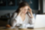 A woman feeling stressed about her work