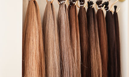 Training detail showing hair colours, lengths and wefts for custom hair-system design; not a client result.