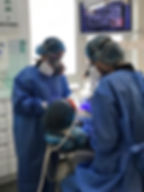 Close-up view of dental amalgam filling being removed