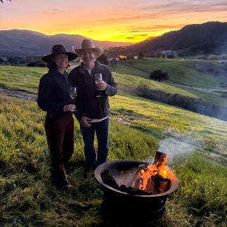 Toasting at sunset overlooking vineyards and rolling hills at Groundstar.
