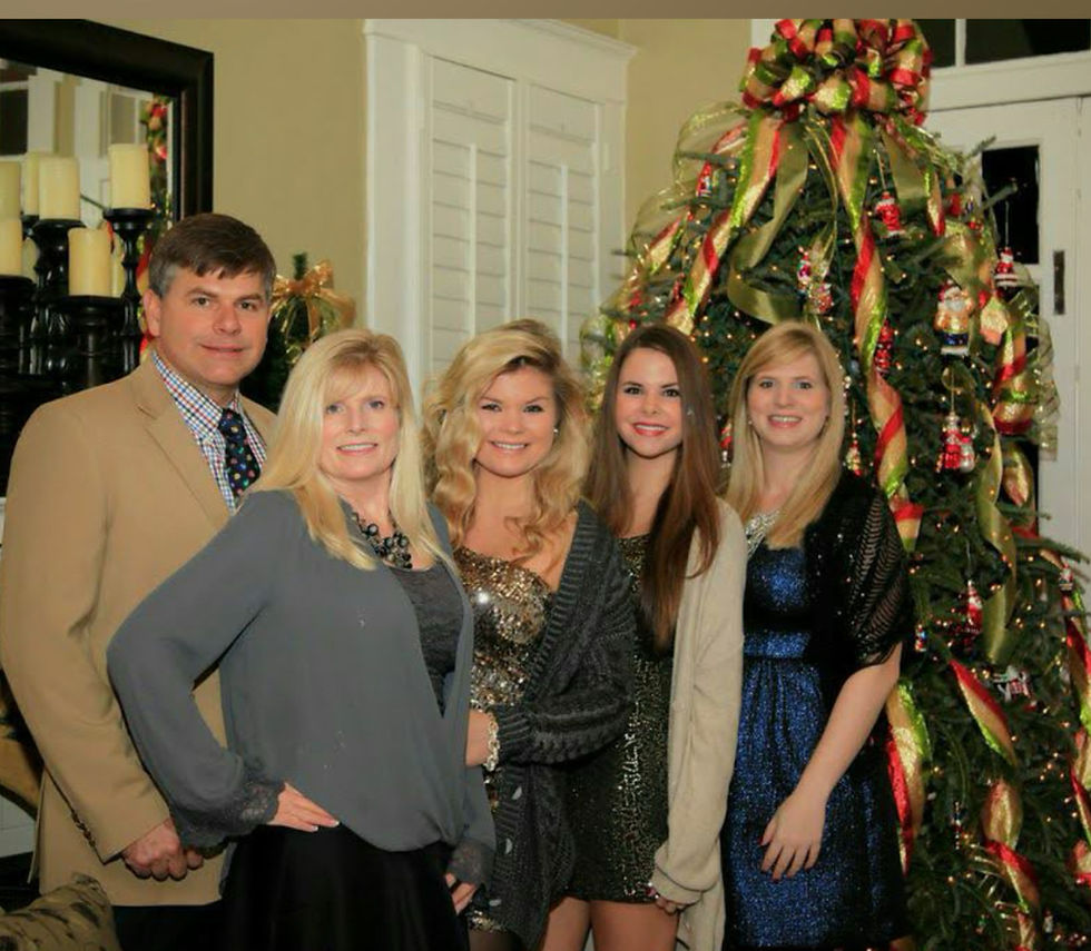 Dina with her family