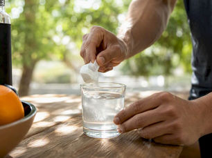 Athlete preparing magnesium supplement drink