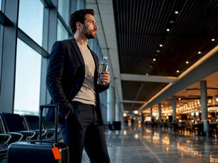 Traveler fasting at an airport gate