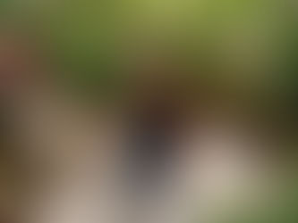 Woman doing breathwork in bright living room