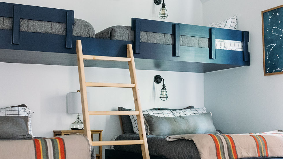 Navy blue bunk beds in a campout themed room.