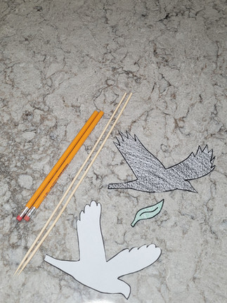 Cutting out the shapes of a dove and raven.Big Box Noah's Ark project. Bible activities for kids