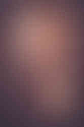 a woman in a lace dress is standing in a doorway