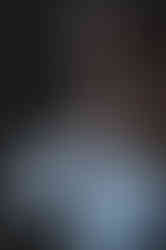 a man in a white shirt has a wedding ring on his finger