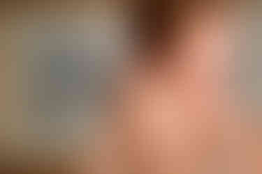 a woman wearing a diamond ring on her finger