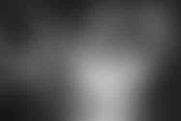 a black and white photo of a bride and groom laughing