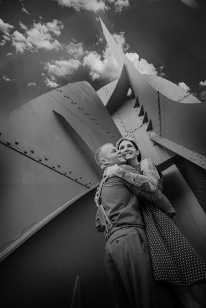 a black and white photo of a man and woman hugging