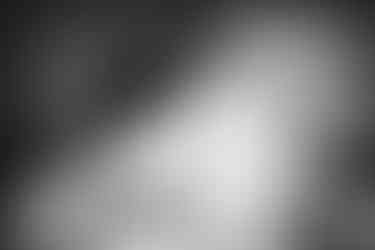 a black and white photo of a man and woman hugging