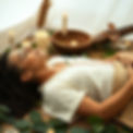 A person laying down in a plant medicine ceremony.jpg