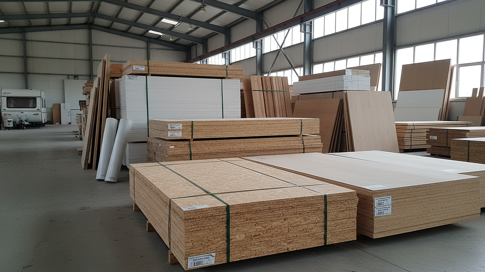 Eye-level view of kayın kontrplak panels stacked in a warehouse