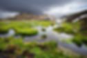 Natural hot spring of Landmannalaugar in early spring with the cloudy, dark sky
