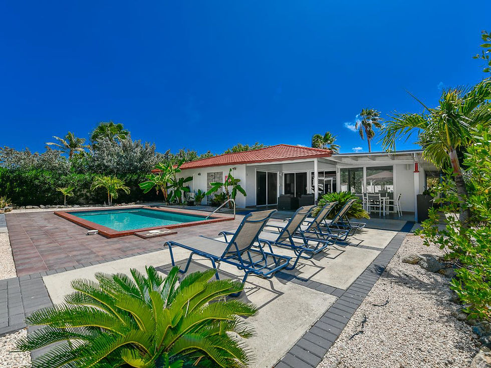 Aruba villa with pool and lounge chairs