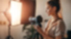 Content creator setting up professional equipment in a home studio