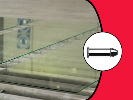 A picture of bulletproof glass on a red background with a white circle containing a bullet
