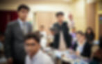 students in a heated asian parliamentary debate