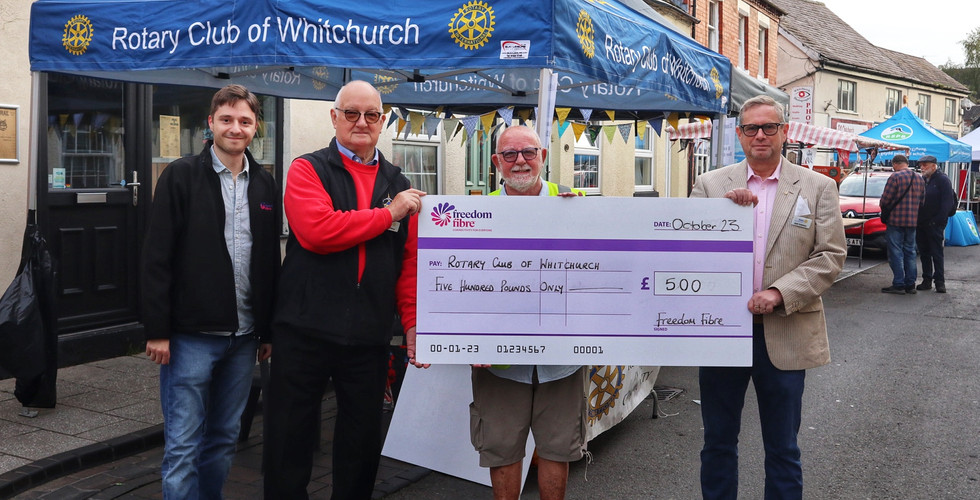 Rotary Club of Whitchurch Holding Grant Cheque 