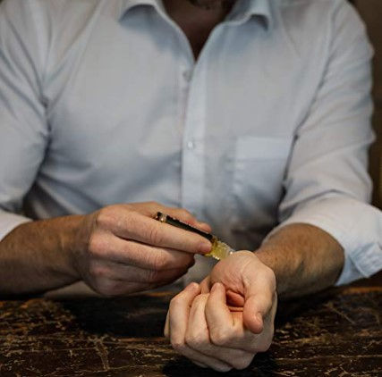 Thumbnail: Man applying rollerball to wrist