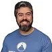 Meet Alex Boettcher, Strength Coach at Zenith Performance and Wellness.
Alex Boettcher’s journey into strength training started a little later than most but has been nothing short of transformative. As someone who didn’t connect with traditional sports growing up, Alex discovered their true calling at the age of 23 when they entered a weight room for the very first time. The simplicity and raw power of barbells and dumbbells sparked an immediate passion, and it wasn’t long before Alex was chasing the thrill of lifting heavy.
This enthusiasm eventually evolved into a love for the sport of Strongman. Despite facing challenges during their first competition, Alex was hooked—not just on competing, but on the continuous process of building strength and resilience. Along this journey, a deep curiosity about training methodologies emerged, inspiring Alex to learn how to help others achieve their strength, mobility, and endurance goals. This drive led them to become a certified personal trainer through NASM.
Now, with over 13 years of experience, Alex specializes in working with individuals new to the gym or those who have faced negative fitness experiences in the past. Their goal is to help these clients build confidence and a strong foundation for lifelong fitness. For more experienced athletes, Alex brings expertise and personalized strategies to refine training and achieve ambitious goals in both fitness and sport.
When Alex isn’t in the gym, they enjoy exploring hiking trails, belting out tunes at karaoke nights, and creating imaginative adventures as a tabletop role-playing game master for friends.