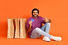 handsome-hindu-man-with-bank-card-and-shopping-bag-2026-01-08-23-13-40-utc.jpg